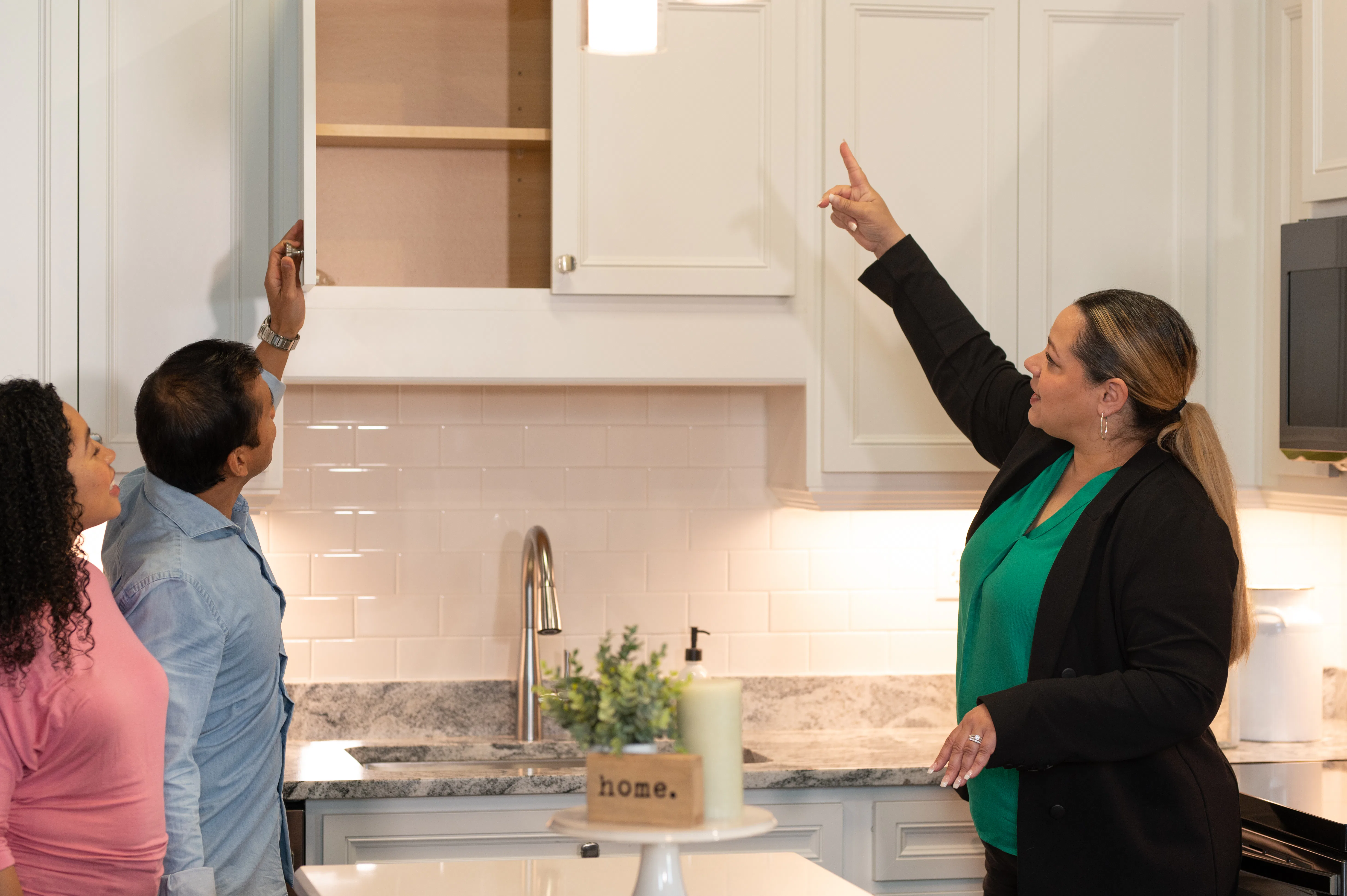 A professional designer helping buyers at the Highland Homes Personal Selection Studio